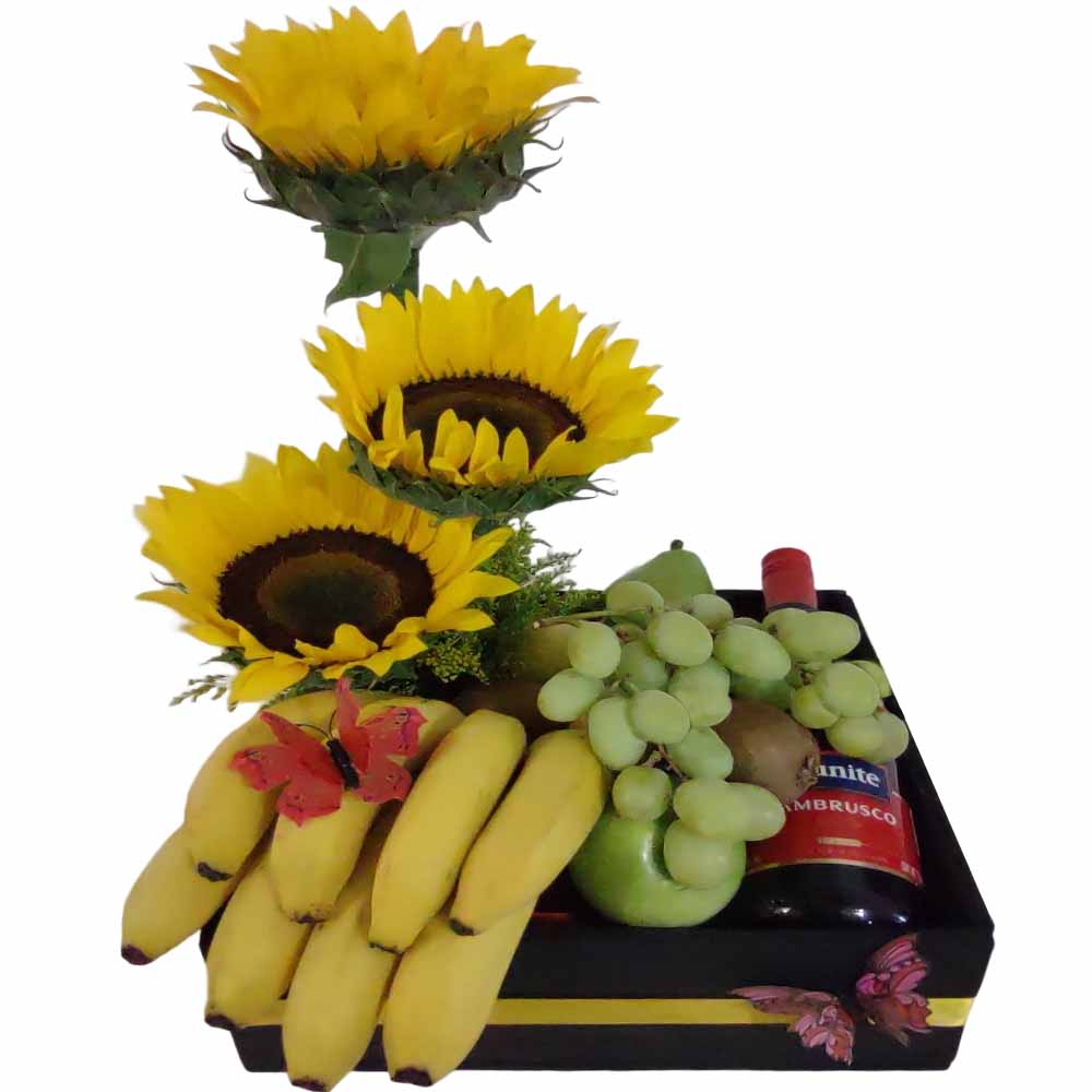 caja con girasoles frutas y vino
