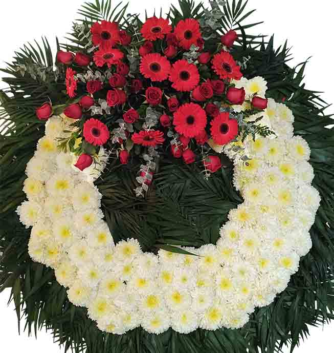 corona para funeral con rosas,gerberas y pompones